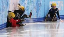 China's Li Jianrou (L), Emily Scott of the U.S., and South Korea's Kim Alang (R) crash during the women's 1,500 metres short track speed skating finals race at the Iceberg Skating Palace at the Sochi 2014 Winter Olympic Games February 15, 2014. REUTERS/David Gray (RUSSIA - Tags: OLYMPICS SPORT SPEED SKATING)