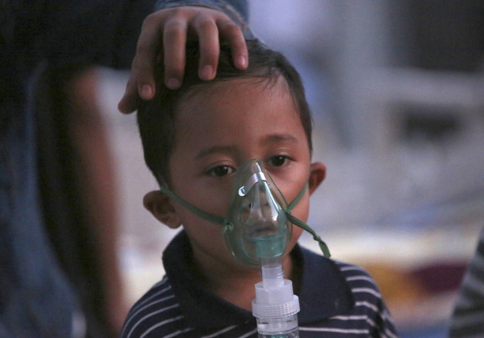 A child injured in the earthquake receives oxygen at a makeshift hospital in Tanjung, North Lombok, Indonesia, Tuesday, Aug. 7, 2018. The north of Lombok was devastated by the powerful quake that struck Sunday night, damaging thousands of buildings and killing a large number of people. Rescuers were still struggling to reach all of the affected areas and authorities expect the death toll to rise. (AP Photo/Tatan Syuflana)