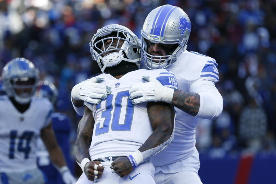 Detroit Lions running back Jamaal Williams (30) celebrates after scoring a touchdown during the first half of an NFL football game against the New York Giants, Sunday, Nov. 20, 2022, in East Rutherford, N.J. (AP Photo/John Munson)