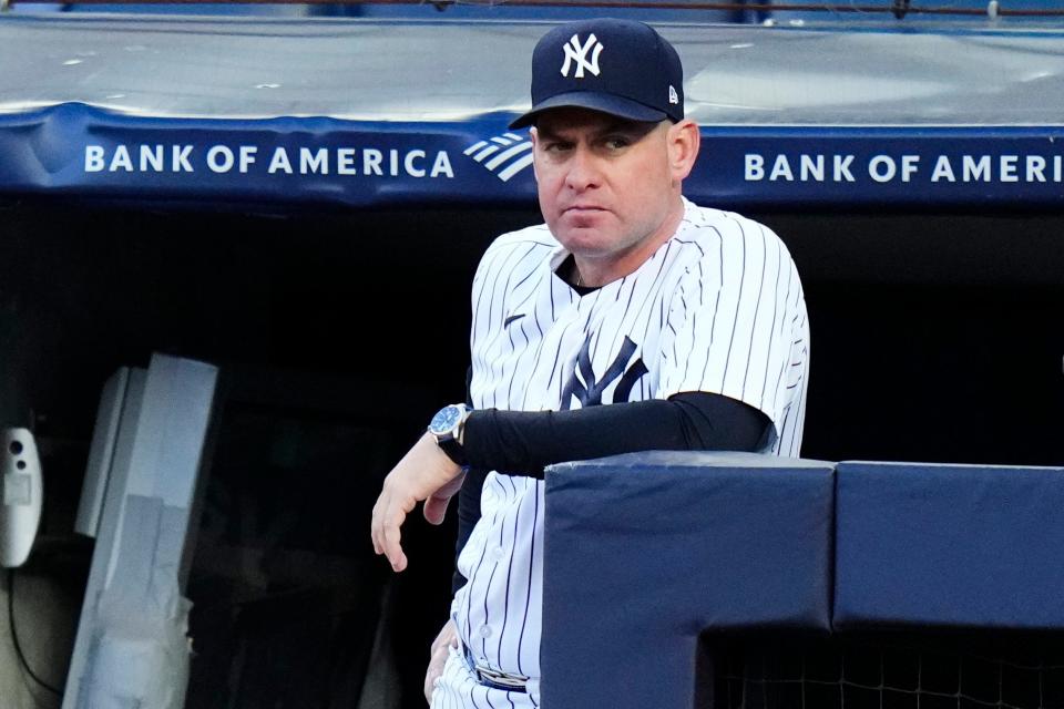 New York Yankees bench coach Carlos Mendoza watches the first inning of a baseball game against the San Diego Padres, Friday, May 26, 2023, in New York.
