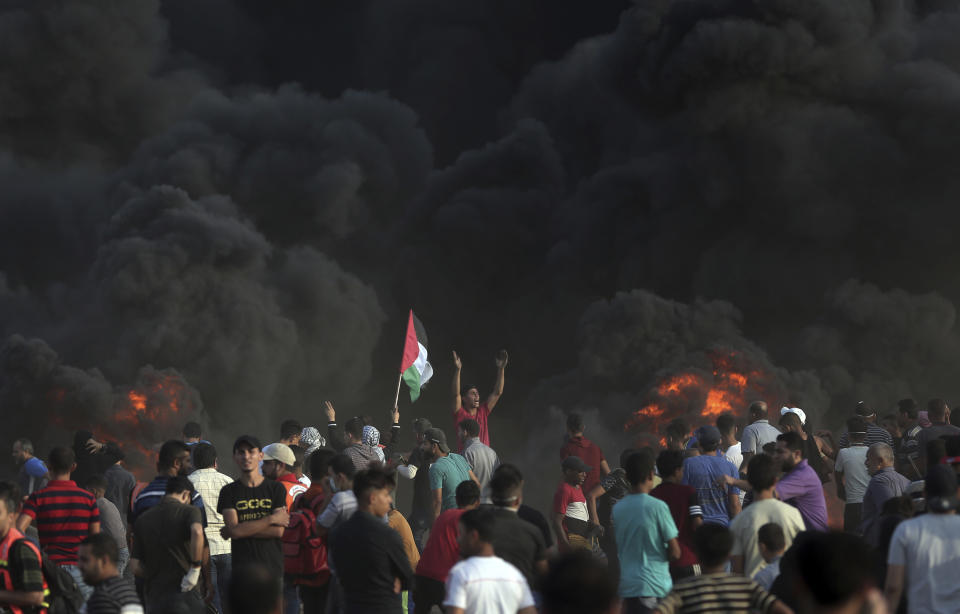 Palestinians protest at the Gaza Strip's border with Israel, Friday, Oct. 5, 2018. (AP Photo/Khalil Hamra)