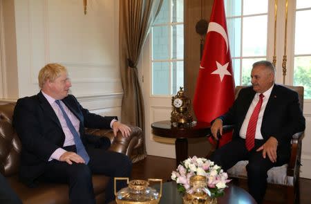 Turkish Prime Minister Binali Yildirim (R) meets with British Foreign Secretary Boris Johnson in Ankara, Turkey, September 27, 2016. Hakan Goktepe/Prime Minister's Press Office/Handout via REUTERS