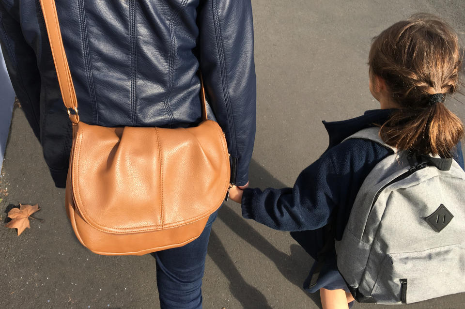 A school has started fining parents who are late to pick up their children after school [Photo: Getty]