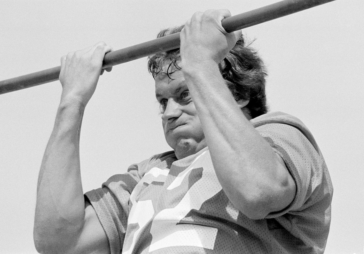 Linebacker Randy Gradishar, the Denver Broncos' No. 1 draft choice, struggles with the bar during chin-up exercises as the NFL team began practice with rookies at Pomona, Calif., July 19, 1974. Gradishar is from Ohio State. Veterans were picketing outside the practice field.