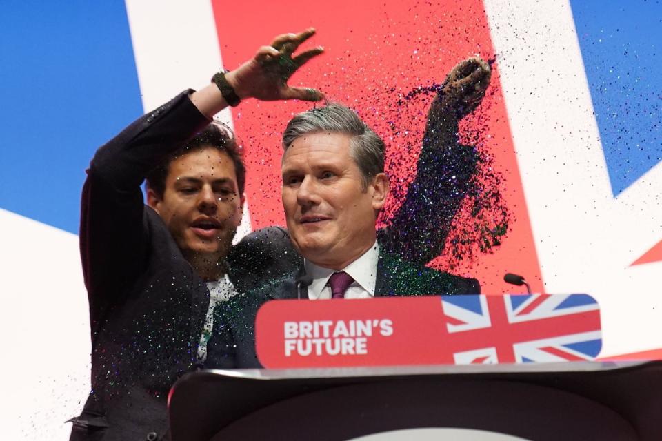 HE’S BEHIND YOU!: Labour leader Sir Keir Starmer got a sparkling surprise when he took the stage at partyconference in Liverpool. The glitter thrower,Yaz Ashwami, was protesting in favourof electoral reform. He later said heregretted making Sir Keir feel unsafe (PA)