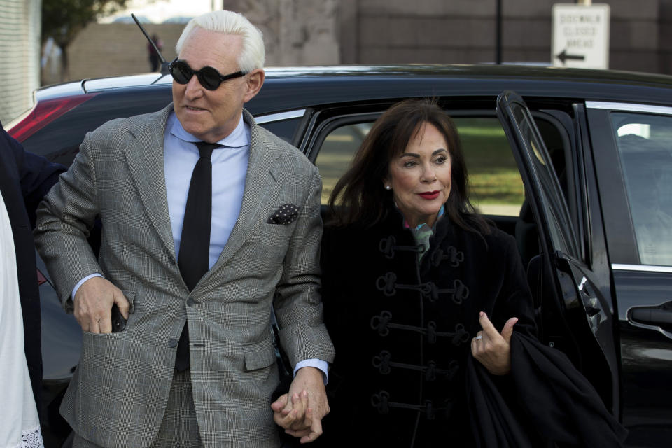 Roger Stone accompanied by his wife Nydia Stone, right, arrives at federal court in Washington, Thursday, Nov. 14, 2019. (AP Photo/Jose Luis Magana)