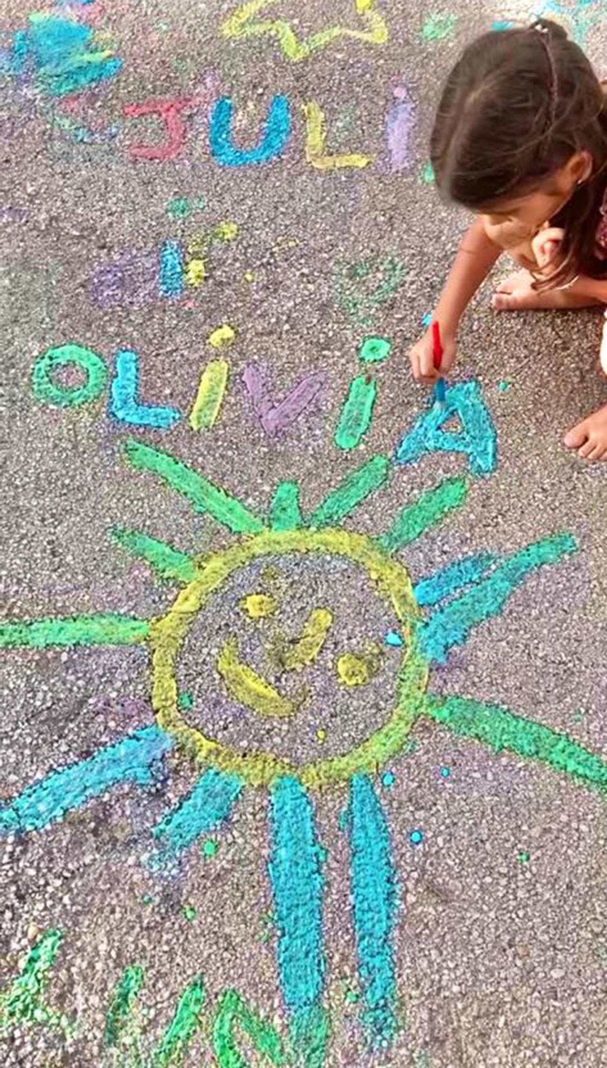 child drawing with chalk paint (Courtesy Stephanie Pflucker and Katrina Suarez)