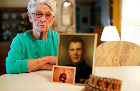 FILE PHOTO: Shirley Hollenback, wife of Gerald "Cactus" Hollenback, whose husband's ashes were lost by Sunset Mesa Funeral Directors poses with his picture and belt in Montrose, Colorado, U.S., December 16, 2017. REUTERS/Rick Wilking