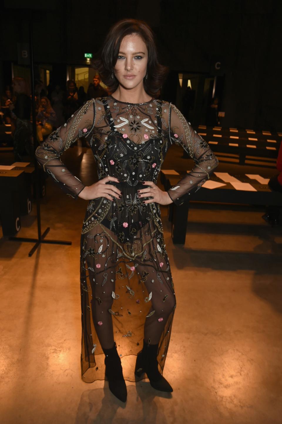 <p>Model Eliza Cummings opted for a sheer floral dress. <i>[Photo: Getty]</i> </p>