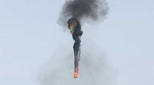 The burning basket and balloon plummet towards the ground. Photo: Geoff Walker.