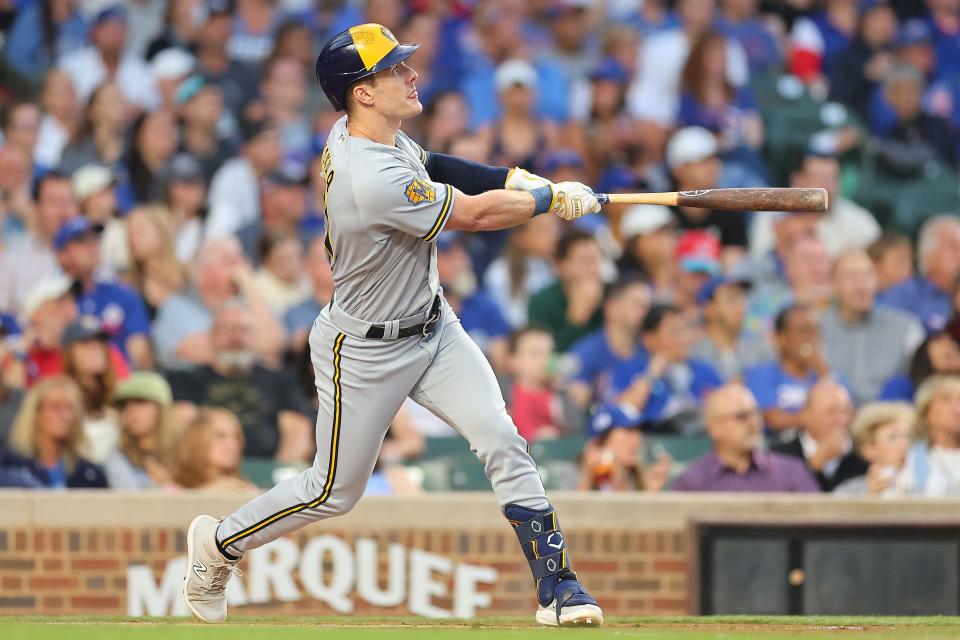 CHICAGO, ILLINOIS - AUGUST 28: Mark Canha #21 of the Milwaukee Brewers hits a two-run home run off Jameson Taillon #50 of the Chicago Cubs (not pictured) during the first inning at Wrigley Field on August 28, 2023 in Chicago, Illinois. (Photo by Michael Reaves/Getty Images)