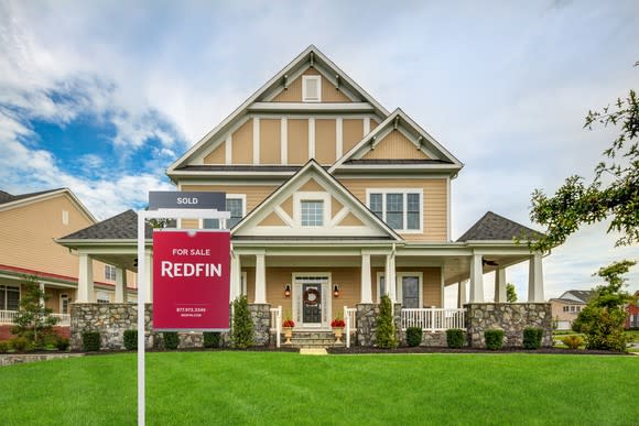 A Redfin For Sale sign in front of a home.