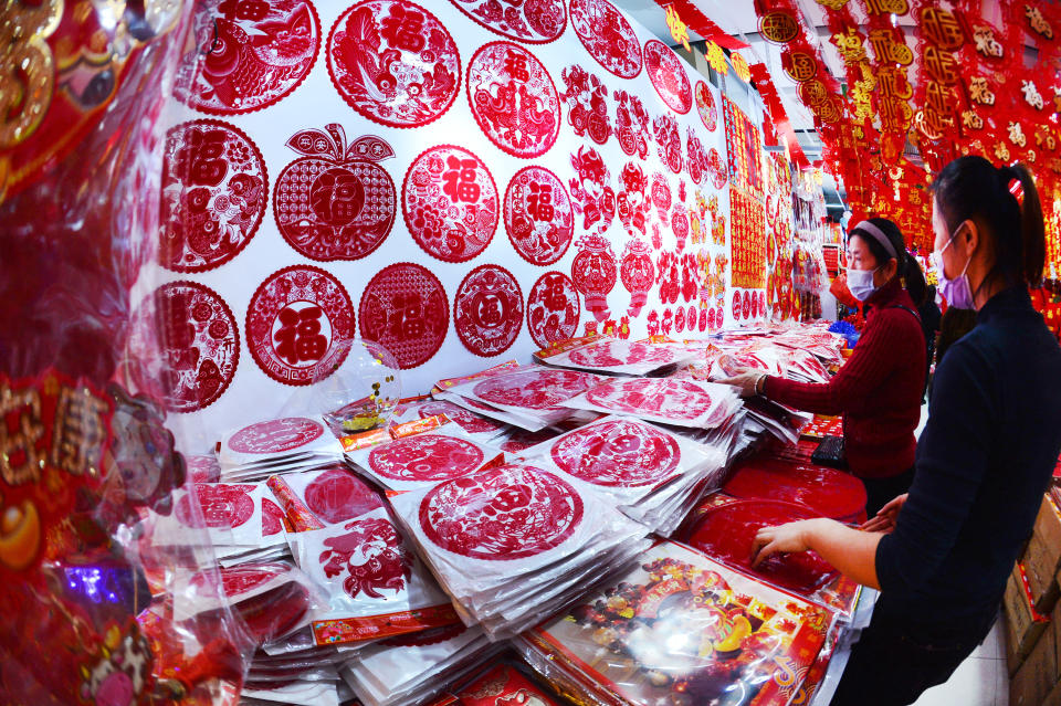 SHENYANG, CHINA - DECEMBER 20, 2020 - People buy ornaments for the Year of the Ox in The Lunar calendar to welcome the New Year in Shenyang, Liaoning province, Dec. 20, 2020.- PHOTOGRAPH BY Costfoto / Barcroft Studios / Future Publishing (Photo credit should read Costfoto/Barcroft Media via Getty Images)