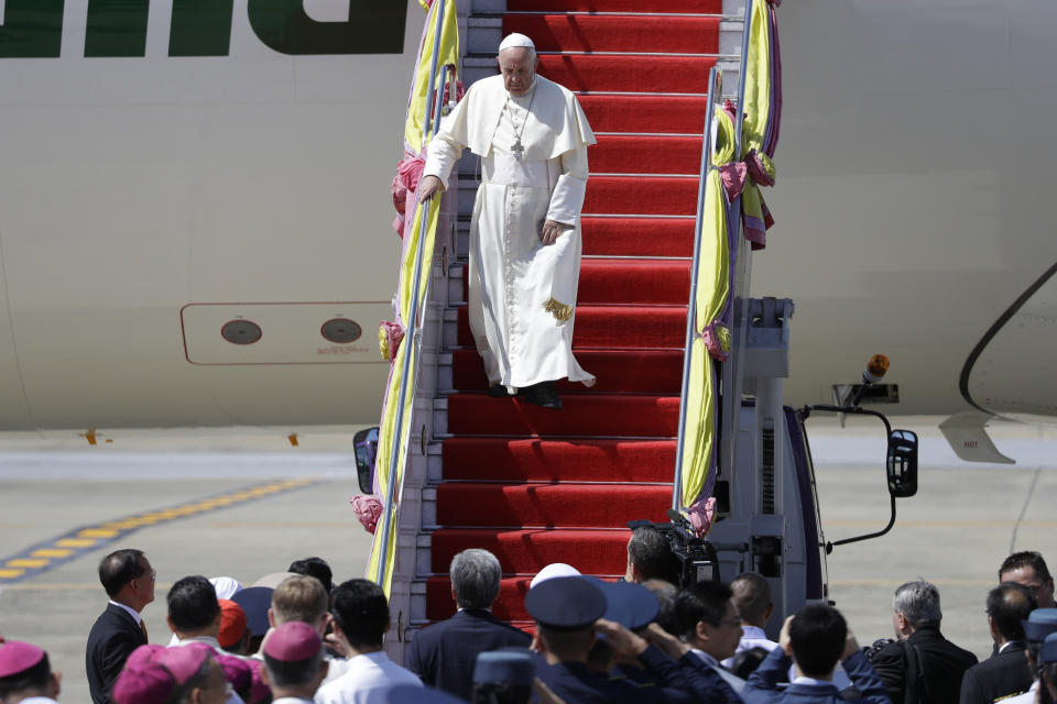 Pope Francis steps down as arrives at Military Air Terminal of Don Muang Airport, Wednesday, Nov. 20, 2019, in Bangkok, Thailand. (AP Photo/Gregorio Borgia)