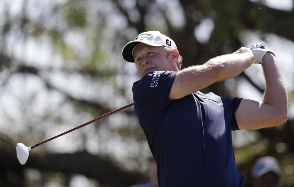 Jamie Donaldson of Wales hits from the fifth tee during the third round of the Cadillac Championship golf tournament Saturday, March 8, 2014, in Doral, Fla. (AP Photo/Lynne Sladky)