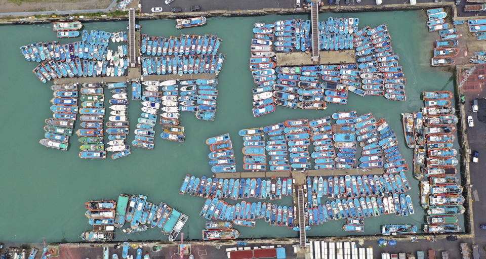 Fishing boats are anchored in port as Typhoon Lingling approaches to Korean peninsular in Mokpo, South Korea, Friday, Sept. 6, 2019. (Chun Jung-in/Yonhap via AP)