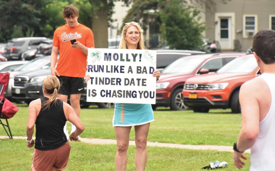 Spectators along the streets of Utica, New York, offered encouragement to runners of the Boilermaker Road Race with colorful signs Sunday, July 9, 2023.