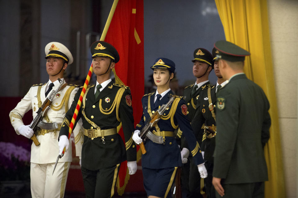 Members of an honor guard march in formation before a welcome ceremony for Pakistan's Prime Minister Imran Khan at the Great Hall of the People in Beijing, Saturday, Nov. 3, 2018. (AP Photo/Mark Schiefelbein)
