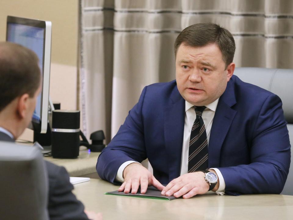 Pyotr Fradkov (R), and Russia's Prime Minister Dmitry Medvedev talk during a meeting in 2019.