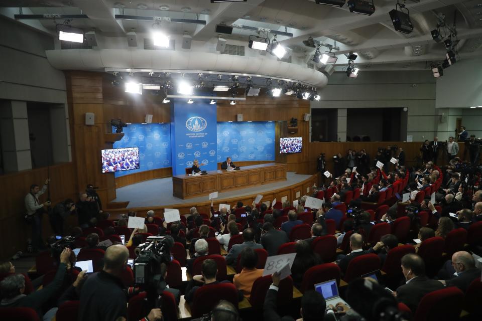 Foreign Ministry spokesperson Maria Zakharova, center left, gestures as Russian Foreign Minister Sergey Lavrov, center right, speaks about his department's 2018 accomplishments during his annual roundup news conference in Moscow, Russia, Wednesday, Jan. 16, 2019. (AP Photo/Pavel Golovkin)