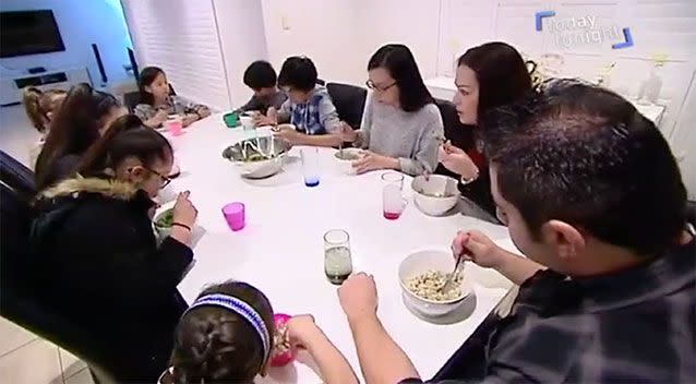 The family having dinner together at home.