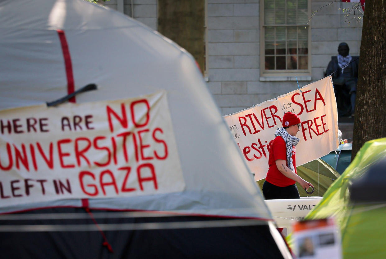 A protester walks in the pro-Palestinian encampment. (Lane Turner / The Boston Globe via Getty Images)