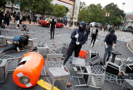 Anti-government protesters build a barricade during a demonstration at Tam Kon Po Street in Hong Kong