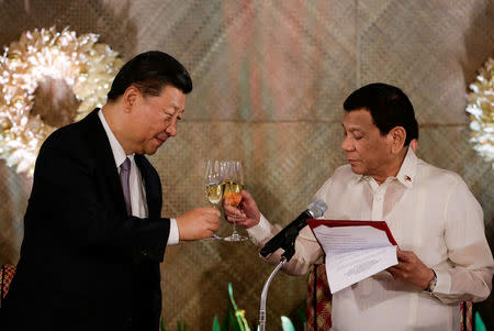 China's President Xi Jinping and Philippine President Rodrigo Duterte toast during a State Banquet at the Malacanang presidential palace in Manila, Philippines, November 20, 2018. Mark Cristino/Pool via Reuters