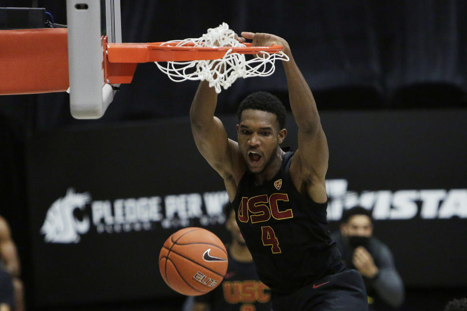 FILE - In this Feb. 13, 2021, file photo, Southern California's Evan Mobley dunks during the second half of the team's NCAA college basketball game against Washington State in Pullman, Wash. Mobley was selected by the Cleveland Cavaliers in the NBA draft Thursday, July 29. (AP Photo/Young Kwak, File)