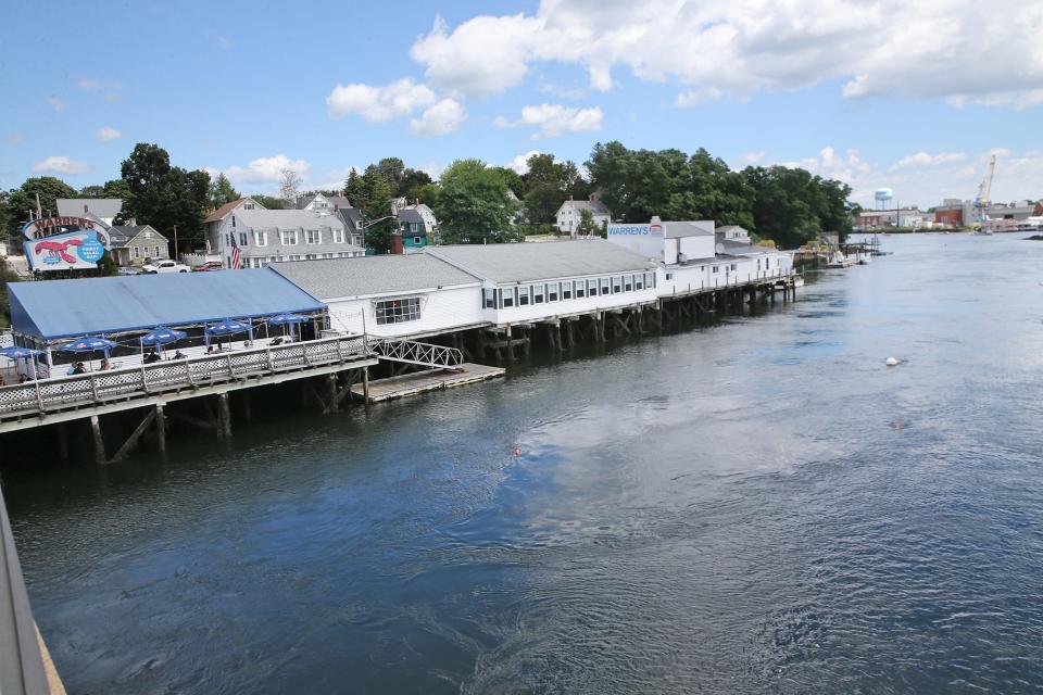 The Portsmouth Naval Shipyard is seen across the river from the well loved Warren's Loster House in Kittery Aug. 11, 2023. The Cunningham family is considering selling Warren’s and the entire property after being approached by the potential buyer.