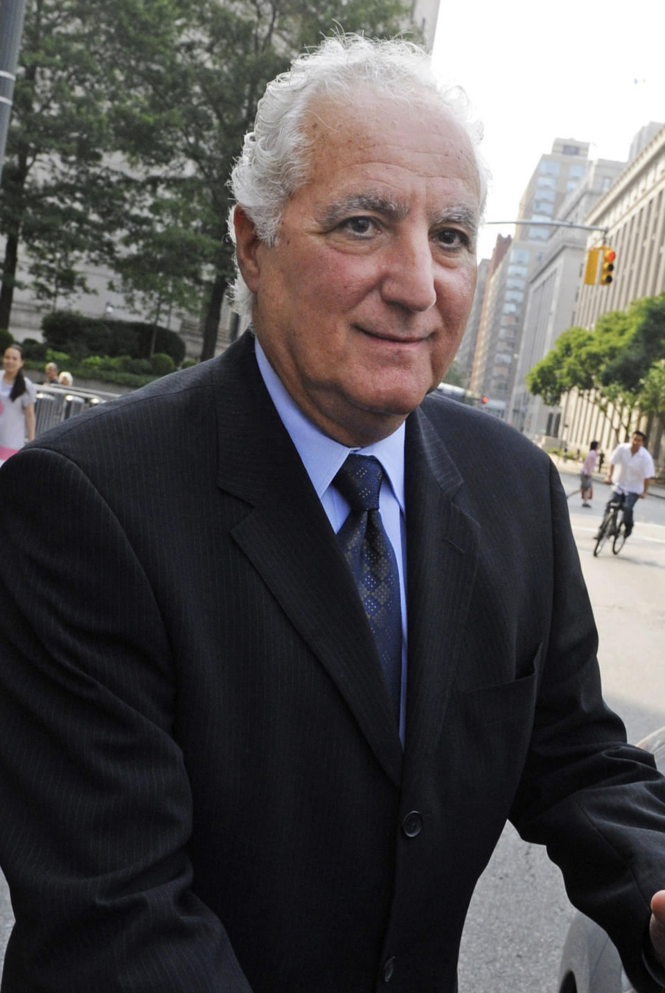 FILE - In this June 21, 2011 file photo, Daniel Bonventre, former director of operations at Bernard L. Madoff Investment Securities, leaves Manhattan federal court in New York. Bonventre is one of five former employees of imprisoned financier Bernard Madoff convicted Monday, March 24, 2014 in New York, at the end of a six-month trial that portrayed them as telling an elaborate web of lies to hide a fraud that enriched them and cheated investors out of billions of dollars. (AP Photo/Louis Lanzano, File)