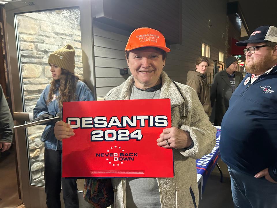 Cyndee Davis poses in her orange precinct captain hat outside of a Ron DeSantis event on Saturday, Jan. 6.