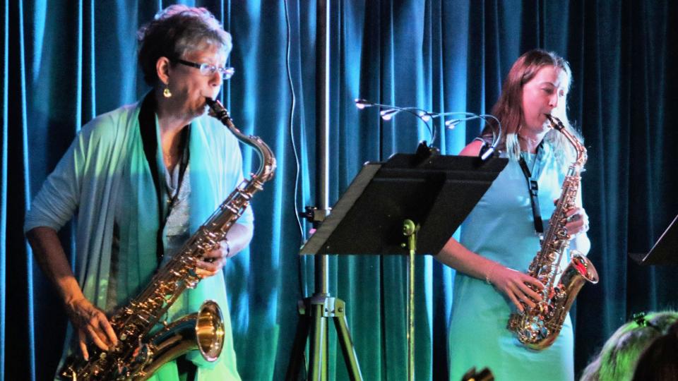 Peggy Terpstra, left, Ecumenical Storehouse board president, and Ellen Carnes play saxophones with the seven-piece Wendel Werner and the Strange Relationship band that will perform July 29 at the Historic Grove Theater in Oak Ridge.
