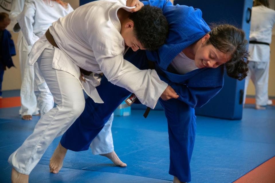 Alejandra Ochoa, top, grapples with Joseph Hernandez during a practice of the Stockton Judo Club at the McKinley Park Community Center in south Stockton.