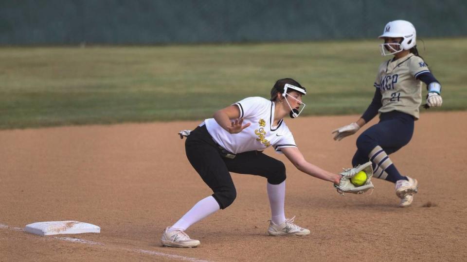 Savannah Ruelas slides into third safe as Brooklyn Michel fields a throw. Mission Prep won 7-0 over San Luis Obispo High School in a softball playoff on May 15, 2024.