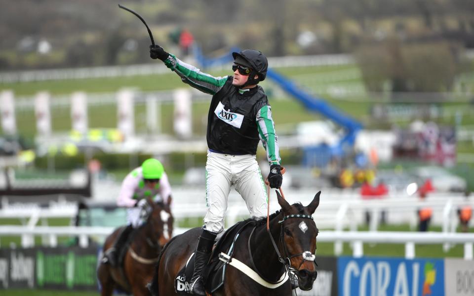 Jockey Nico de Boinville punches the air after riding Altior to victory in the Champion Chase  - Â©SPORTSFILE