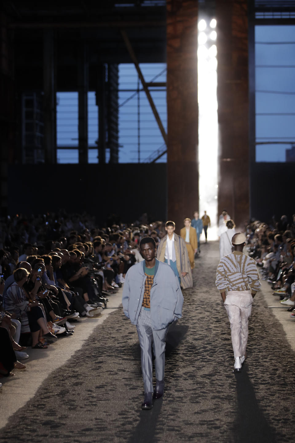 Models wear creations as part of the Ermenegildo Zegna men's Spring-Summer 2020 collection, unveiled during the fashion week, in Milan, Italy, Friday, June 14, 2019. (AP Photo/Luca Bruno)
