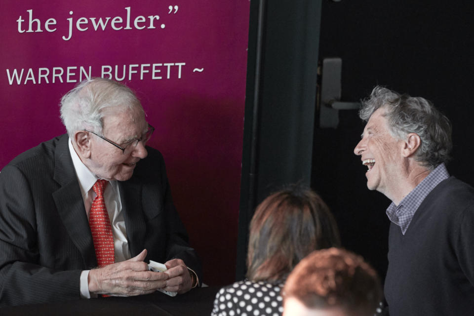 Warren Buffett, Chairman and CEO of Berkshire Hathaway, left, jokes with Gill Gates, right, during a game of bridge following the annual Berkshire Hathaway shareholders meeting in Omaha, Neb., Sunday, May 5, 2019. (AP Photo/Nati Harnik)