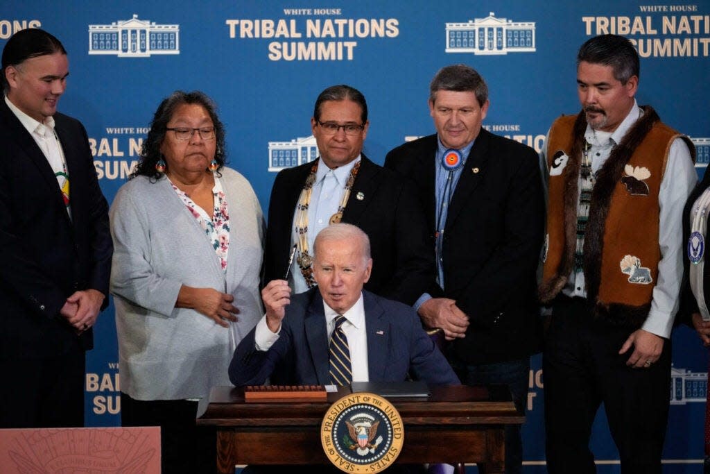 President Joe Biden signs an executive order at the 2023 White House Tribal Nations Summit at the U.S. Department of Interior on Wednesday in Washington, D.C.