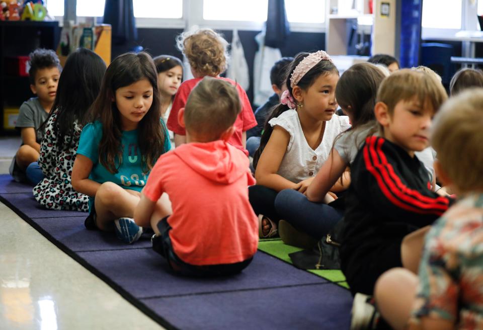 Sequiota Elementary School kindergarteners pair up with another student during a writing exercise in teacher Rachel Hoing's class on Tuesday, April 11, 2023.