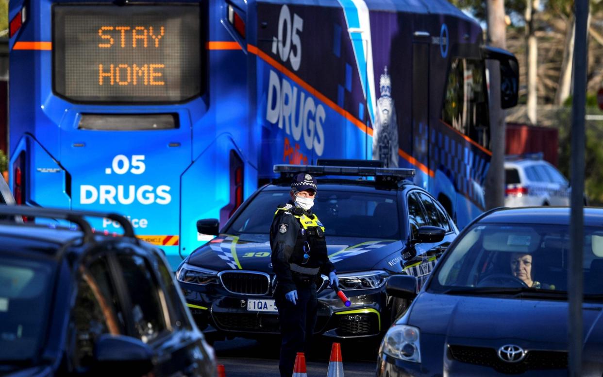 Police pull vehicles aside at a checkpoint in the locked-down suburb of Broadmeadows in Melbourne - WILLIAM WEST/AFP via Getty Images