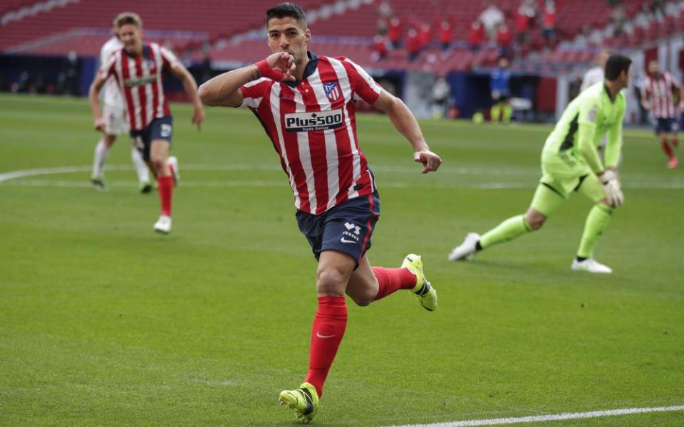 Atlético Madrid’s Luis Suárez celebrates after scoring the opening goal