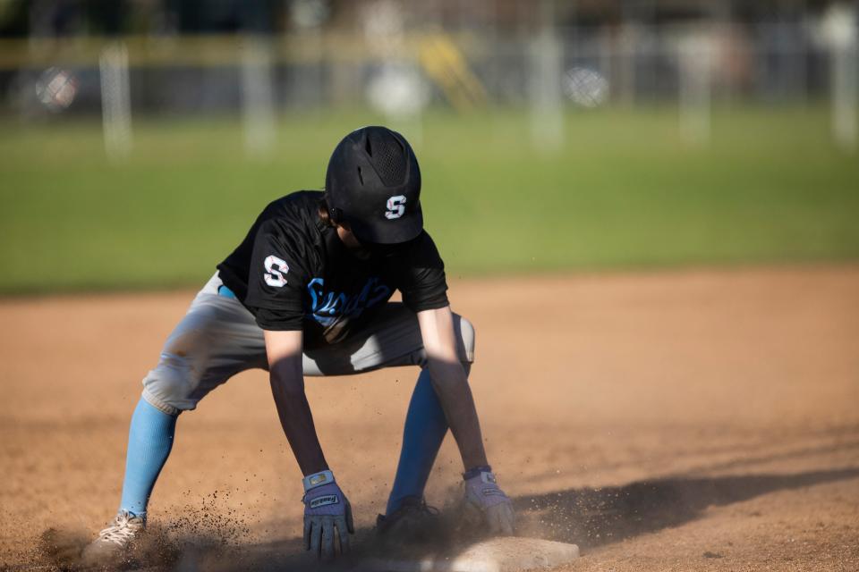 South Salem's Cole Weiland (19) slides to third base during the game against North Salem at Barrick Field on Friday, April 16, 2021 in Salem.
