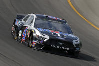 Kevin Harvick races out of turn one during a NASCAR Cup Series auto race at Michigan International Speedway in Brooklyn, Mich., Sunday, Aug. 11, 2019. (AP Photo/Paul Sancya)