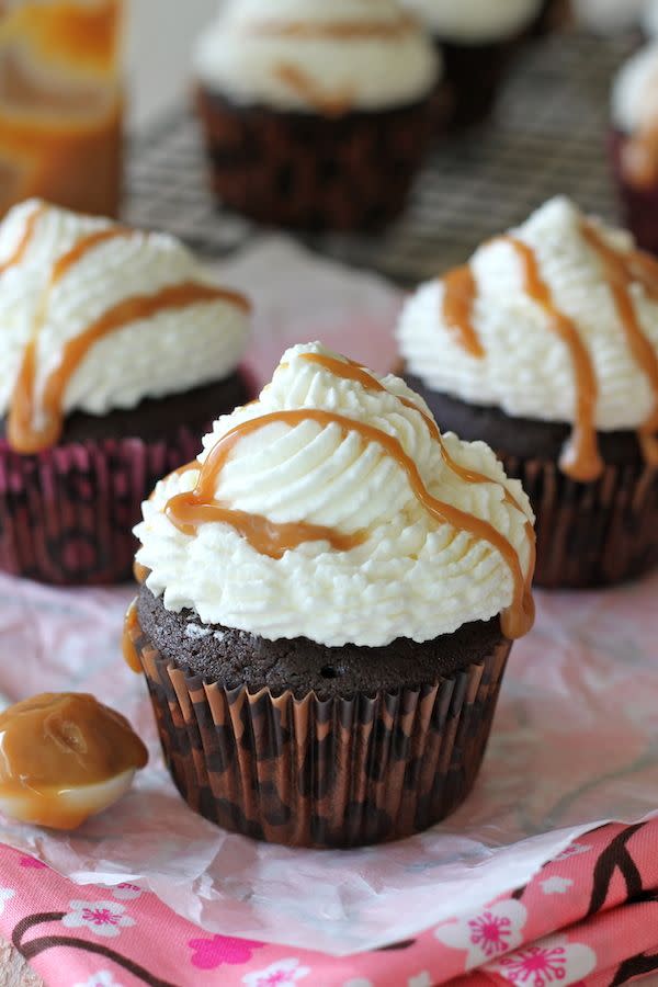 <p>Chocolate lovers will want to make these these mocha pumpkin cupcakes ASAP. They're topped with whipped cream frosting and drizzled with indulgent dulce de leche.</p><p><strong>Get the recipe at <a href="https://damndelicious.net/2013/01/06/pumpkin-mocha-cupcakes-with-whipped-cream-frosting-and/" rel="nofollow noopener" target="_blank" data-ylk="slk:Damn Delicious;elm:context_link;itc:0;sec:content-canvas" class="link ">Damn Delicious</a>.</strong> </p>