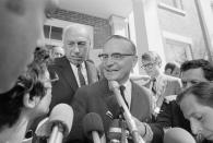 Attorneys Edward Hanify (R) and Robert Clark Jr. (L-rear) talk with reporters as they emerged from Dukes County Court in Edgartown, Mass. The two are representing Sen. Edward Kennedy, and attended sessions where the ground rules of the inquest into the death of Mary Jo Kopechne, who was killed last month in a car driven by Sen. Edward Kennedy, were discussed with Judge James Boyle. (Photo: Bettmann/Getty Images)