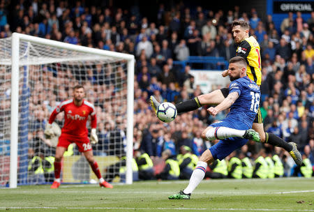 Soccer Football - Premier League - Chelsea v Watford - Stamford Bridge, London, Britain - May 5, 2019 Chelsea's Olivier Giroud shoots at goal as Watford's Craig Cathcart attempts to block Action Images via Reuters/Matthew Childs