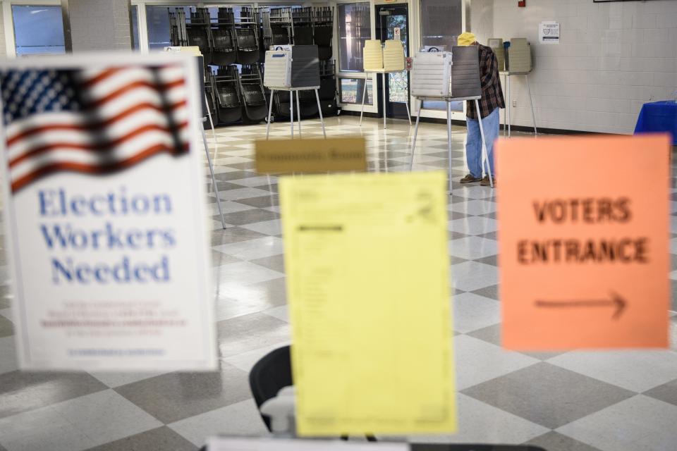 A voter fills out his ballot at a polling site in the Hope Mills Recreation Center on Tuesday, Nov. 2, 2021.