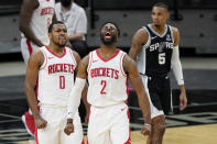 Houston Rockets guard Sterling Brown (0) and forward David Nwaba (2) celebrate their win over the San Antonio Spurs in an NBA basketball game in San Antonio, Thursday, Jan. 14, 2021. (AP Photo/Eric Gay)