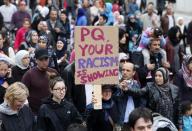 Demonstrators protest against Quebec's proposed Charter of Values in Montreal, September 14, 2013. Thousands took to the streets to denounce the province's proposed bill to ban the wearing of any overt religious garb by government paid employees. REUTERS/ Christinne Muschi(CANADA - Tags: POLITICS CIVIL UNREST RELIGION)